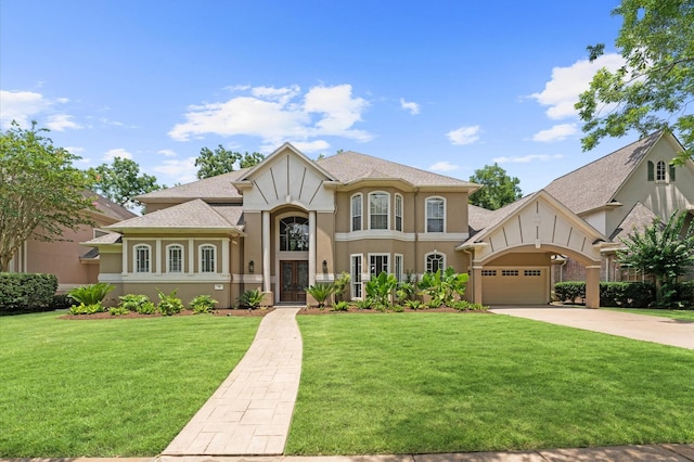 18 Sullivans Ct, Missouri City, TX 77459 - tudor home with french doors, stucco siding, a front yard, and driveway