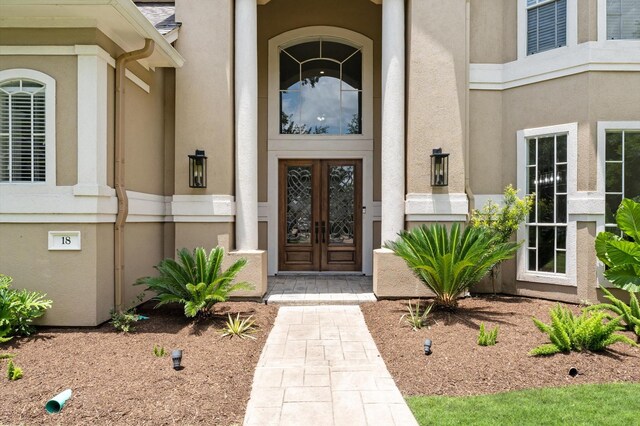 18 Sullivans Ct, Missouri City, TX 77459 - doorway to property featuring french doors and stucco siding