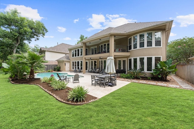 18 Sullivans Ct, Missouri City, TX 77459 - rear view of house featuring ceiling fan, a fenced backyard, a balcony, and a patio area
