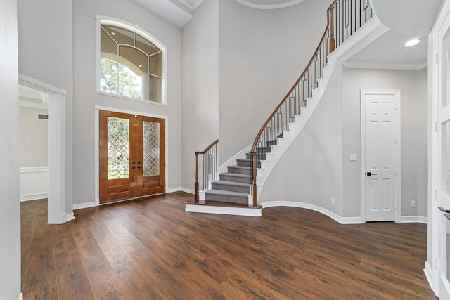 18 Sullivans Ct, Missouri City, TX 77459 - entryway featuring stairs, a towering ceiling, wood finished floors, french doors, and crown molding