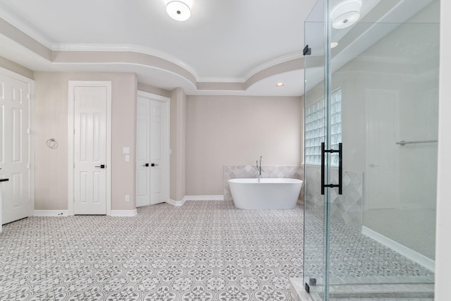 18 Sullivans Ct, Missouri City, TX 77459 - bathroom with ornamental molding, a freestanding bath, a shower stall, tile patterned floors, and a tray ceiling