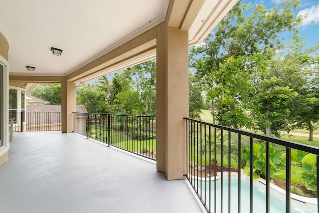 18 Sullivans Ct, Missouri City, TX 77459 - balcony featuring view of pool area and view of wooded area
