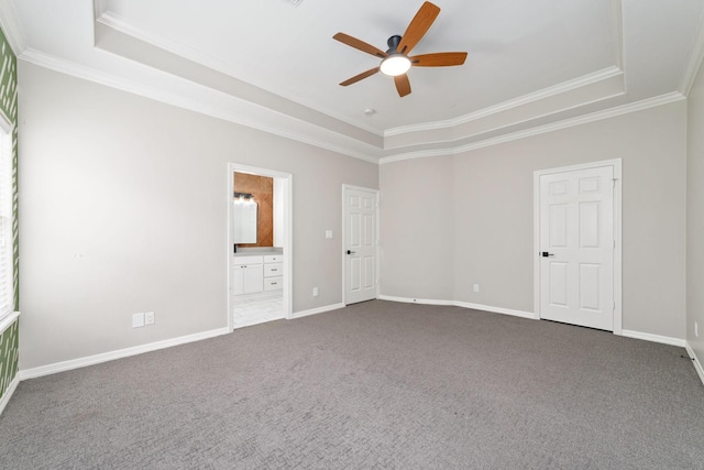 18 Sullivans Ct, Missouri City, TX 77459 - unfurnished bedroom with a tray ceiling, crown molding, dark carpet, ensuite bathroom, and ceiling fan