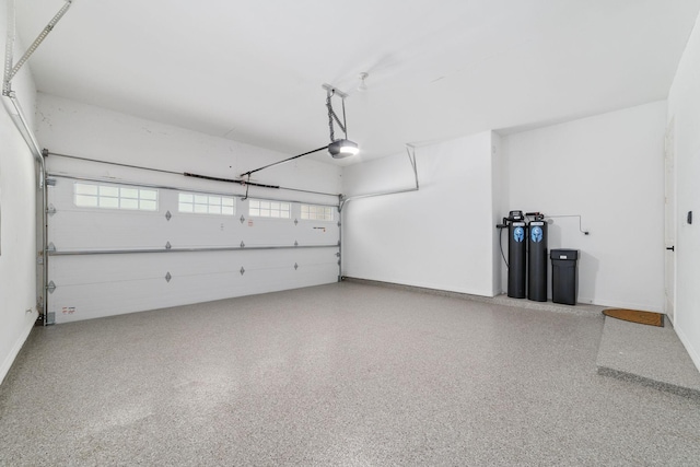 18 Sullivans Ct, Missouri City, TX 77459 - garage with a garage door opener and baseboards