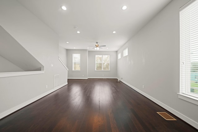 703 Schwartz St, Houston, TX 77020 - unfurnished living room featuring ceiling fan, dark wood-style floors, and recessed lighting