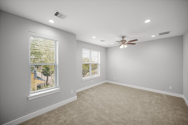 703 Schwartz St, Houston, TX 77020 - empty room featuring light carpet, recessed lighting, and a ceiling fan