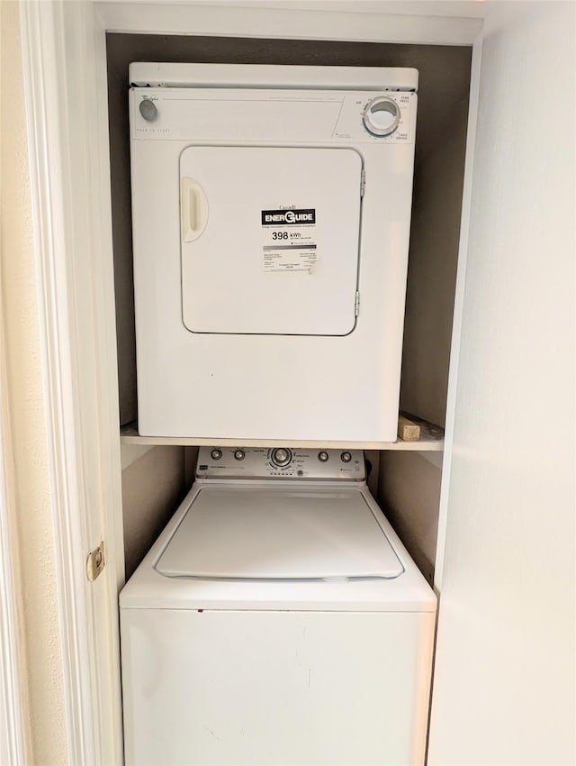 2750 Holly Hall St Unit 1504, Houston, TX 77054 - laundry area featuring stacked washer and clothes dryer