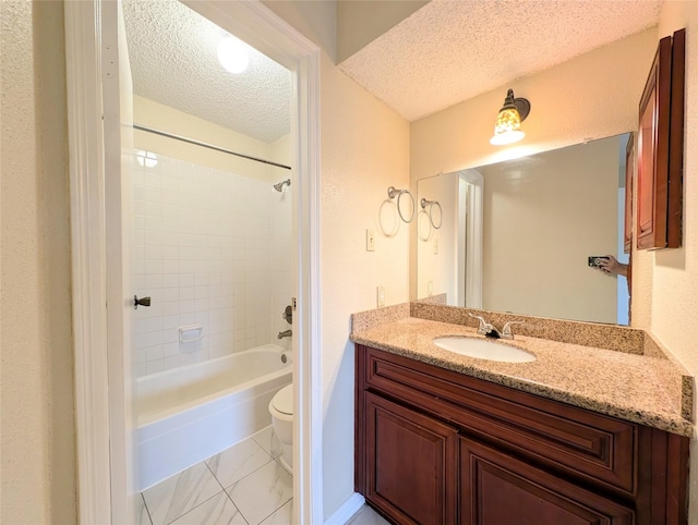 2750 Holly Hall St Unit 1504, Houston, TX 77054 - full bath featuring a textured ceiling, vanity,  shower combination, and marble finish floors