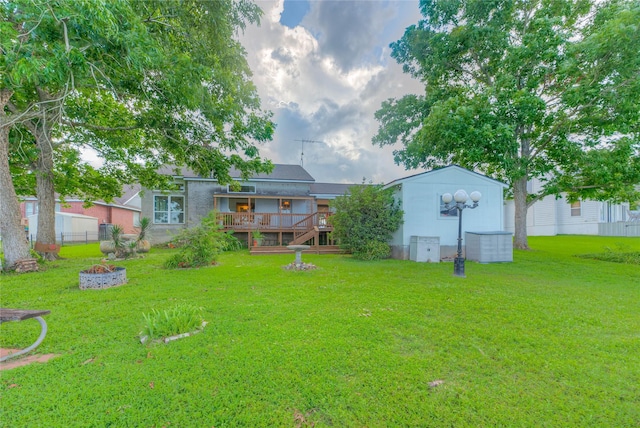 440 Lakeview Drive Loop, Coldspring, TX 77331 - view of yard with a deck, stairway, and a fire pit