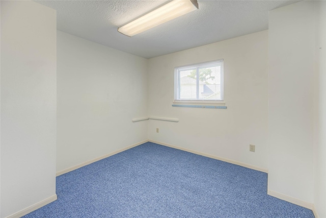 440 Lakeview Drive Loop, Coldspring, TX 77331 - carpeted empty room featuring a textured ceiling and baseboards