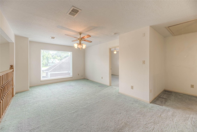 440 Lakeview Drive Loop, Coldspring, TX 77331 - carpeted empty room featuring attic access, a ceiling fan, and a textured ceiling