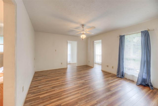 440 Lakeview Drive Loop, Coldspring, TX 77331 - empty room featuring wood finished floors, ceiling fan, and a textured ceiling