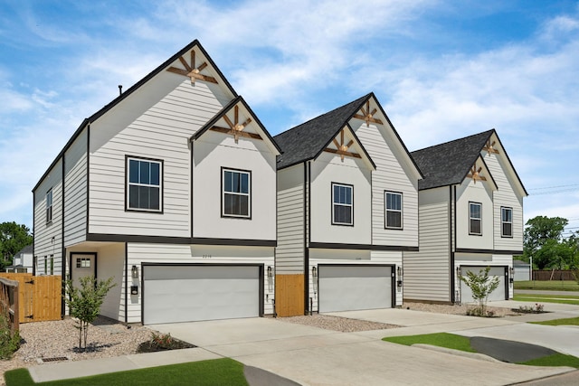 2208 Mansfield, Houston, TX 77091 - view of front facade with an attached garage, driveway, and roof with shingles