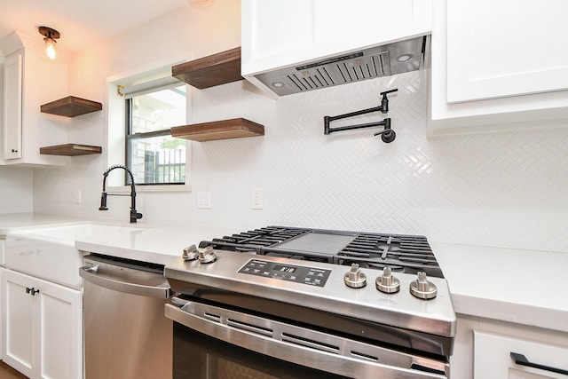 2826 Durban Dr, Houston, TX 77043 - kitchen featuring stainless steel appliances, open shelves, decorative backsplash, custom range hood, and white cabinetry