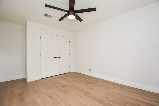 2826 Durban Dr, Houston, TX 77043 - unfurnished bedroom featuring light wood-style floors, a closet, and a ceiling fan