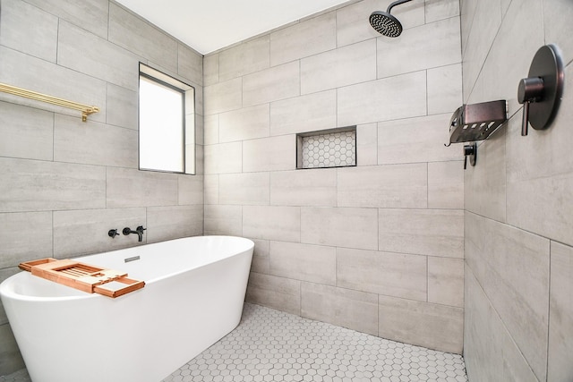 2826 Durban Dr, Houston, TX 77043 - full bath featuring tile walls, a freestanding tub, a tile shower, and tile patterned flooring