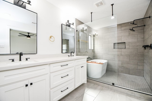 2826 Durban Dr, Houston, TX 77043 - bathroom with a tile shower, double vanity, a freestanding tub, and a ceiling fan
