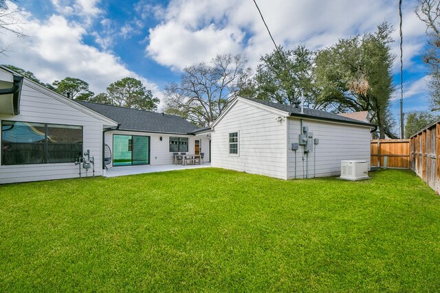 2826 Durban Dr, Houston, TX 77043 - back of property featuring a patio, a fenced backyard, an outbuilding, and a shingled roof
