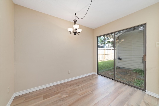 7238 N Hearthstone Green Dr, Houston, TX 77095 - unfurnished dining area with light wood finished floors and a chandelier
