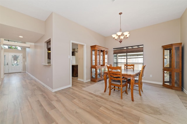 7238 N Hearthstone Green Dr, Houston, TX 77095 - dining space featuring a chandelier and light wood-style floors