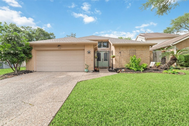 7238 N Hearthstone Green Dr, Houston, TX 77095 - ranch-style home featuring brick siding, concrete driveway, a garage, and a front yard