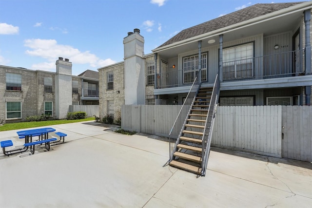 6606 De Moss Dr Unit 1406, Houston, TX 77074 - view of property's community with stairway and a patio area