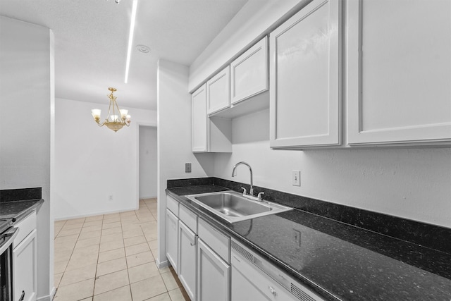 6606 De Moss Dr Unit 1406, Houston, TX 77074 - kitchen featuring a chandelier, light tile patterned flooring, dark stone counters, white cabinetry, and pendant lighting