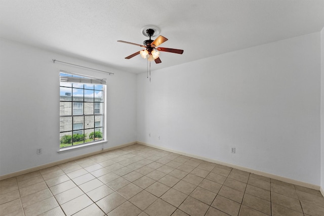6606 De Moss Dr Unit 1406, Houston, TX 77074 - spare room featuring healthy amount of natural light, ceiling fan, and light tile patterned floors