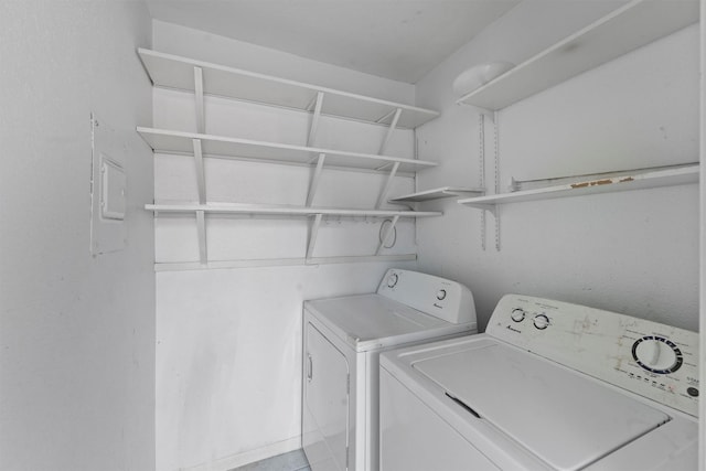 6606 De Moss Dr Unit 1406, Houston, TX 77074 - laundry area with washing machine and dryer