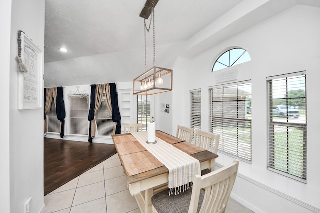 5231 S Fm 565th Rd, Cove, TX 77523 - tiled dining area featuring lofted ceiling and a chandelier