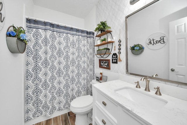 5231 S Fm 565th Rd, Cove, TX 77523 - bathroom with vanity, wood finished floors, and a shower with shower curtain