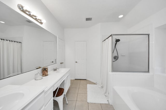 5231 S Fm 565th Rd, Cove, TX 77523 - bathroom with a shower with shower curtain, a garden tub, double vanity, and tile patterned floors