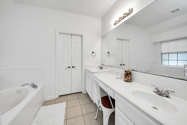 5231 S Fm 565th Rd, Cove, TX 77523 - full bath with double vanity, a bath, and tile patterned flooring