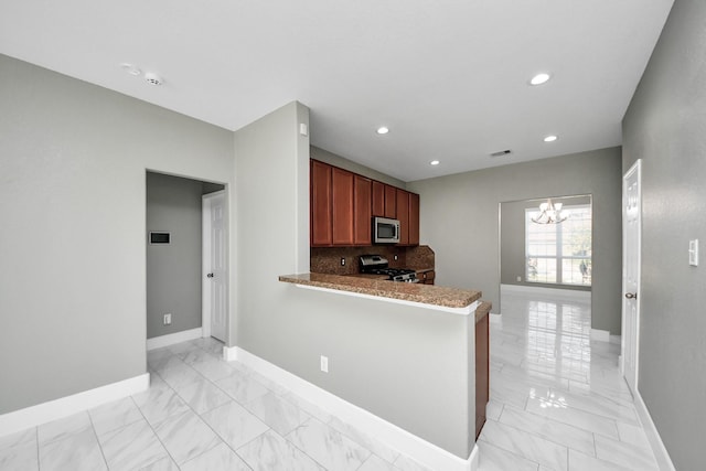 14722 Scenic Sky Way, Houston, TX 77049 - kitchen featuring stainless steel microwave, stove, light marble finish floors, a chandelier, and recessed lighting