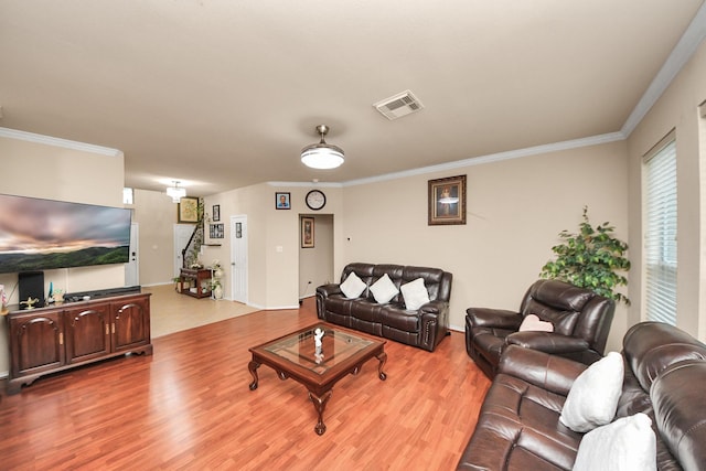 20310 Port Bishop Ln, Richmond, TX 77407 - living area featuring wood finished floors and ornamental molding