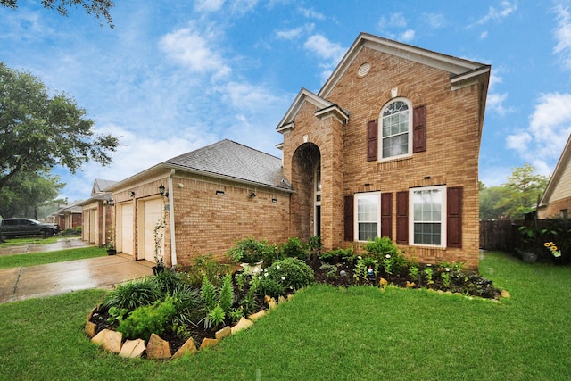 20310 Port Bishop Ln, Richmond, TX 77407 - traditional home with brick siding, concrete driveway, a front lawn, and an attached garage