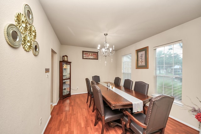 20310 Port Bishop Ln, Richmond, TX 77407 - dining area featuring a chandelier and wood finished floors