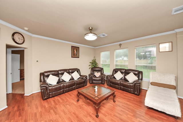 20310 Port Bishop Ln, Richmond, TX 77407 - living room featuring wood finished floors and ornamental molding