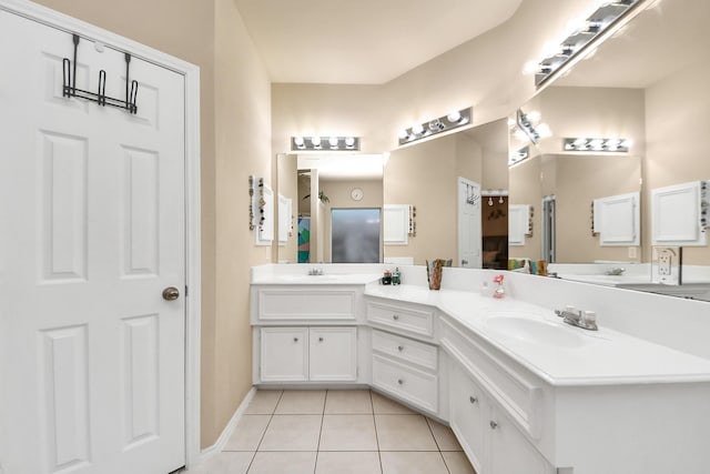20310 Port Bishop Ln, Richmond, TX 77407 - bathroom with double vanity and tile patterned flooring