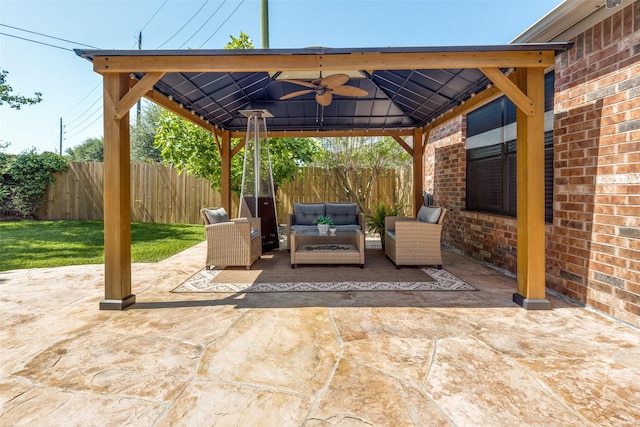 11823 Solon Springs Dr, Tomball, TX 77375 - fenced backyard with a gazebo, an outdoor living space, a patio area, and ceiling fan