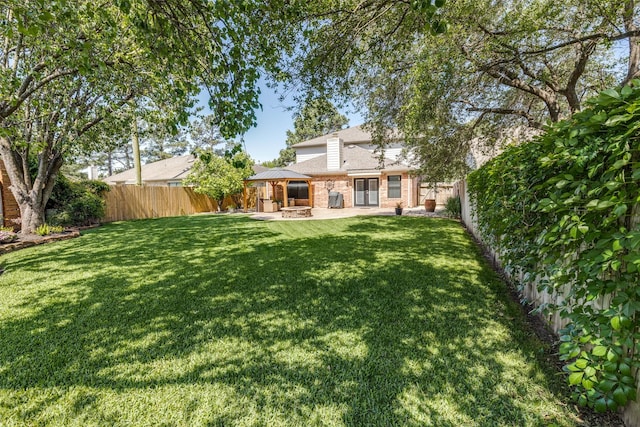 11823 Solon Springs Dr, Tomball, TX 77375 - fenced backyard featuring a patio