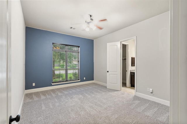 23411 Reynolds Pond Dr, New Caney, TX 77357 - unfurnished bedroom featuring light colored carpet and a ceiling fan