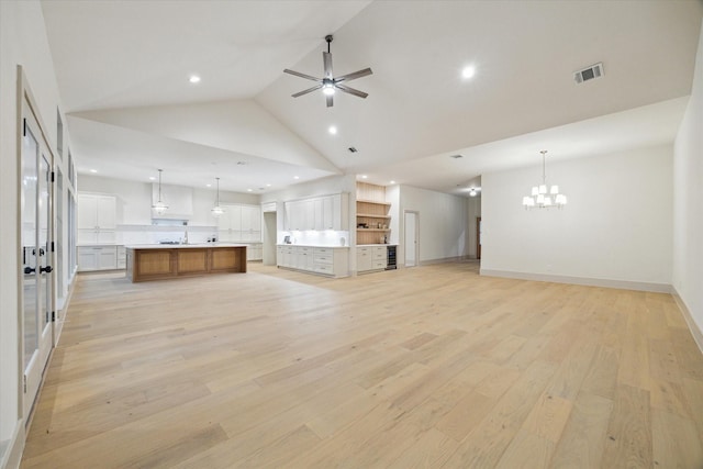 6227 Grovewood Ln, Houston, TX 77008 - unfurnished living room featuring a chandelier, light wood finished floors, recessed lighting, high vaulted ceiling, and ceiling fan