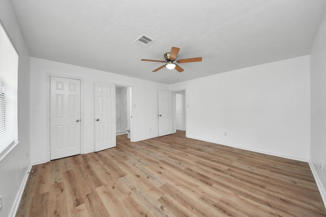 9250 Wiloak St, Houston, TX 77028 - unfurnished bedroom featuring light wood-type flooring and ceiling fan