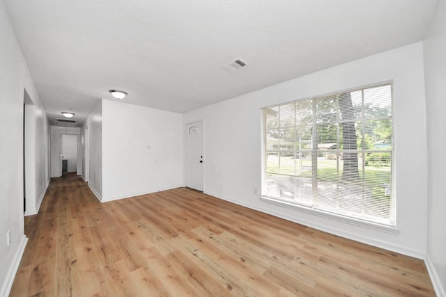 9250 Wiloak St, Houston, TX 77028 - unfurnished living room featuring light wood-type flooring and baseboards
