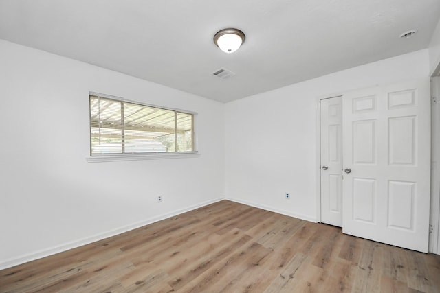 9250 Wiloak St, Houston, TX 77028 - unfurnished bedroom with light wood-style floors and a closet