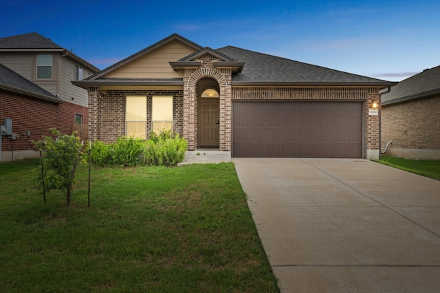 6328 Dorothy Muree Dr, Temple, TX 76502 - view of front of property with brick siding, concrete driveway, a front yard, an attached garage, and roof with shingles