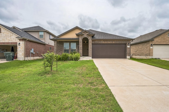 6328 Dorothy Muree Dr, Temple, TX 76502 - view of front facade with brick siding, an attached garage, a front yard, and driveway