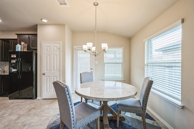 6328 Dorothy Muree Dr, Temple, TX 76502 - dining space with a chandelier, lofted ceiling, and light tile patterned floors