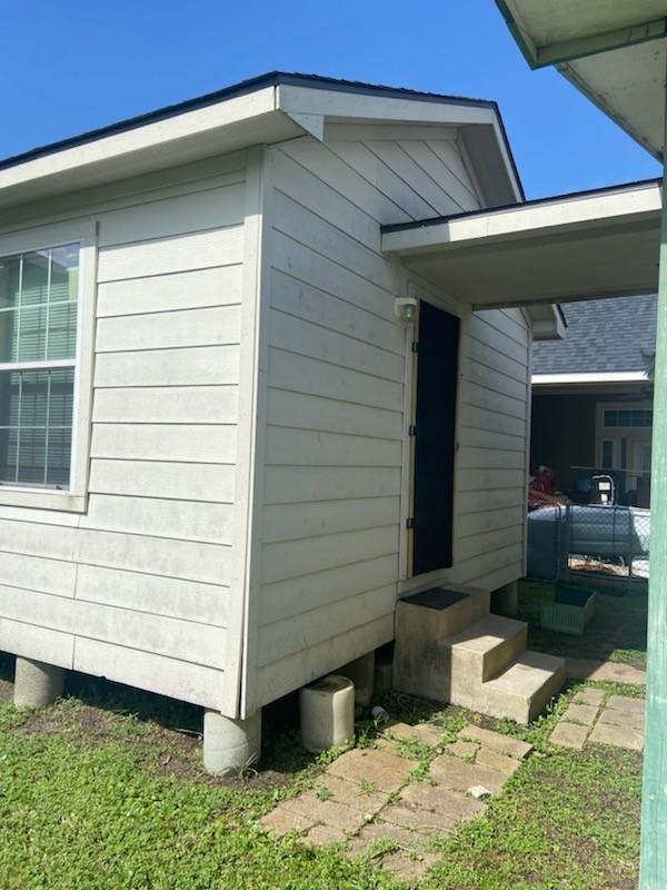 5514 Borden Ave, Galveston, TX 77551 - view of side of property featuring entry steps